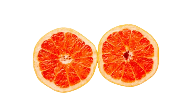 Two oranges cut in half, side by side, symbolizing the importance of diet and breast health awareness