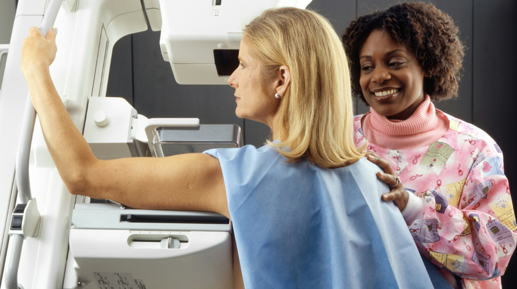 A woman undergoing a mammogram screening, promoting early detection and breast health awareness